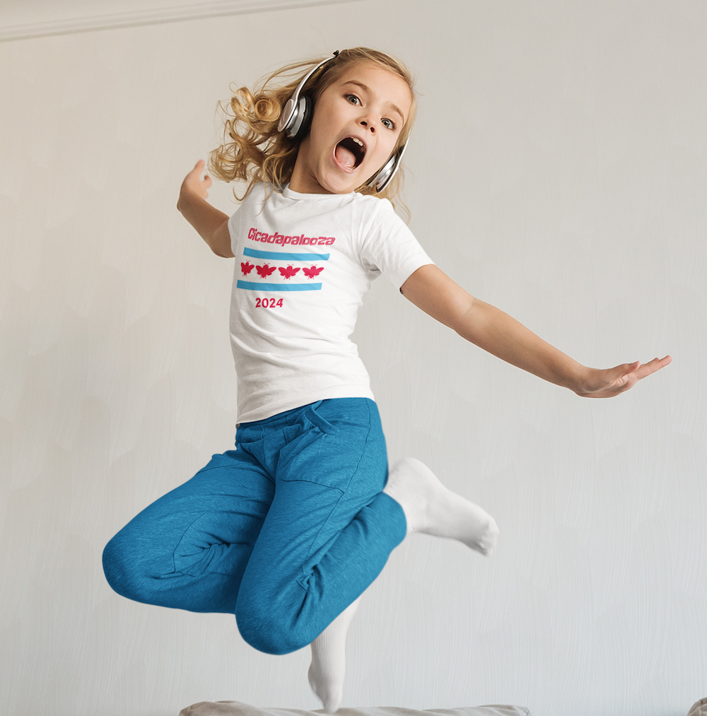 A 9 year old girl wears headphones and jumps in the air.  She wears a white t-shirt with red text saying, "Cicadapalooza." Also, the Chicago flag with the stars replaced by cute, red cicadas.