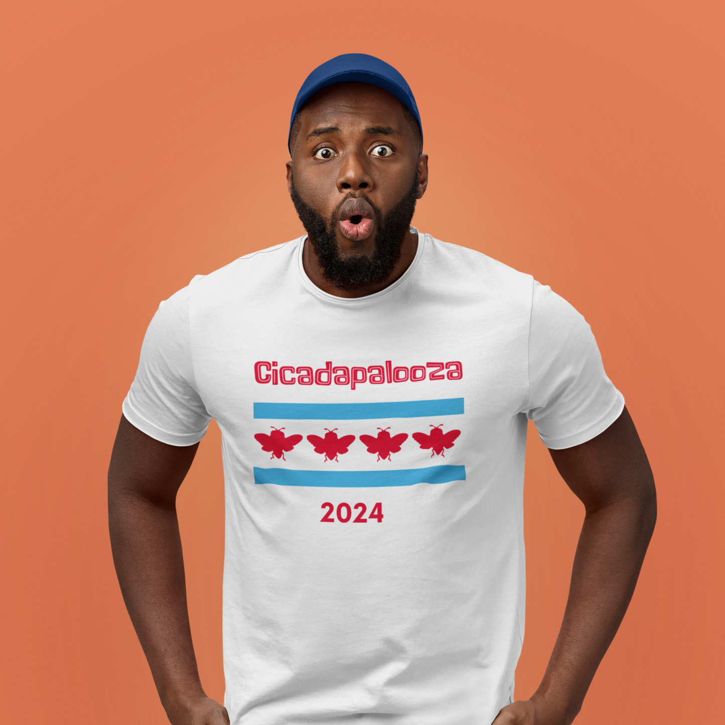 A fit  man wears a white t-shirt with the text "cicadapalooza" and the Chicago flag with the red stars replaced by cute, red cicadas. He has an expression of shock and fear on his face.